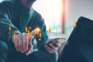 investment stock market data analysis concept, businessman using smartphone analyst  virtual trading graph with blurred coins, trading online, financial mobile application platform photo