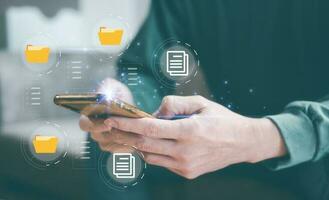 paperless concept. man holding smartphone checking on electronic form documentation checklist, questionnaire survey, data management, application.business and technology photo