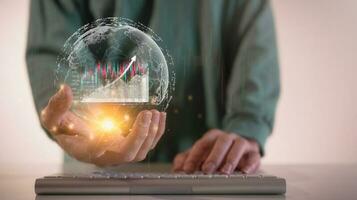 financial investment concept, businessman working on computer keyboard and smartphone with virtual trading graph in concept of investment business growth and marketing photo
