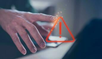 internet network security concept, man working on computer  with triangle warning sign developer with triangle caution warning sign for notification error and maintenance, e-document data protection photo
