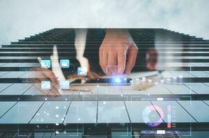 business data analysis concept, analysts working with virtual charts graph document in modern tall office building background, multi exposure, business planning and strategy photo