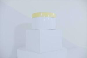 White blank glossy cosmetic plastic jar mock up template on isolated white background, cosmetic container for body cream, gel, butter, bath salt, skin care, powder. 3D illustration photo