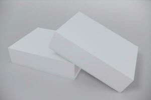 White closed square folding gift box mock up on white background. Side view. 3d illustration. photo