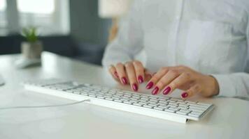 Woman typing on a computer keyboard. Concept of remote work video