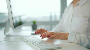 Woman typing on a computer keyboard. Concept of remote work video