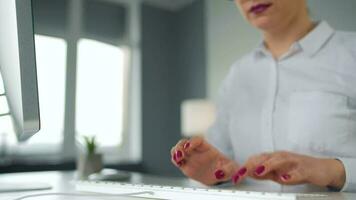Woman typing on a computer keyboard. Concept of remote work video