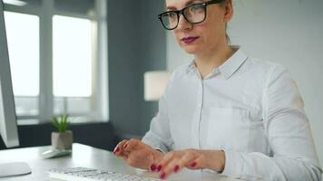 Woman typing on a computer keyboard. Concept of remote work video