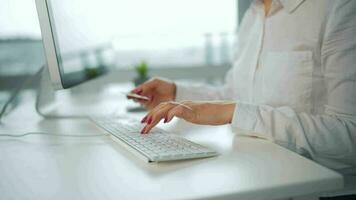 Woman typing credit card number on computer keyboard. She making online purchase. Online payment service video