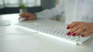 Woman typing on a computer keyboard. Concept of remote work video