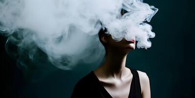 Cloudy smoke covering face of woman. Concept of heavy smoking or vaping. photo