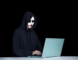 Anonymous hacker with laptop. Concep, t of hacking cybersecurity, cybercrime, cyberattack, etc. photo