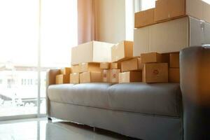 The parcel boxes that are stacked on top of each other are parcel boxes that are ready to be shipped to the shipping company to be taken into the system and forwarded to the customer. photo