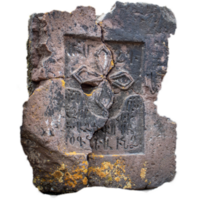 Close up stone cross on rough stone wall concept photo. Historical tombs png