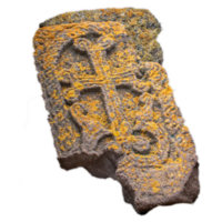 Close up stone cross with yellow lichen on rough stone wall concept photo. png