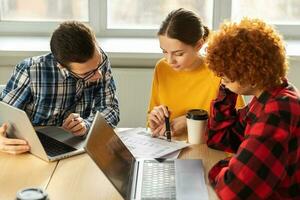 Focused female team leader discuss financial statistics brainstorming business meeting with partners clients at office. Lady boss leader young businesswoman. Diverse corporate professional team. photo