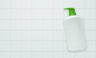 Top view Liquid soap bottle with tile background Bathroom accessories photo