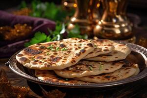 Naan bread in plate. Flatbread with spices. Indian cuisine. photo