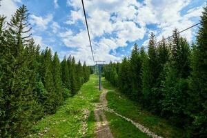 Mountains with open cable cars lift, Karpacz, Poland photo