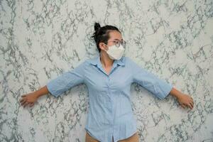 elegant womanman wearing a mouth protection to prevent getting sick at work or on the way to work  isolated on White background, pandemic and social distancing concept.Covid-19 photo