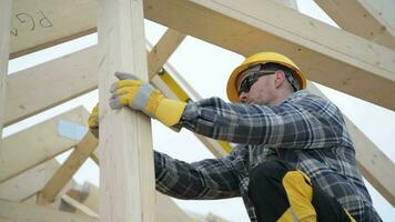 Worker Checking Wooden Beams Levels with Spirit Tool video