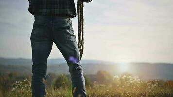 Cowboy with a Rope in His Hand Staying in Front of His Farmland video