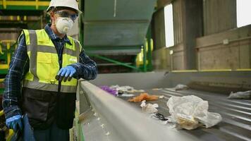 City Trash Sorting Facility Worker in His 40s Supervise Sorting Processes video