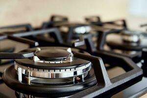 Gas stove with hob in kitchen, close up photo