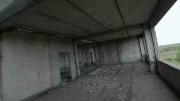 FPV drone flies maneuverable through an abandoned building. Post-apocalyptic location without people video