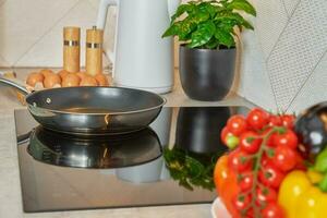 Induction hob with frying pan, Kitchen appliance photo