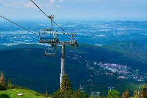 Mountains with open cable cars lift, Karpacz, Poland photo