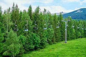 Mountains with open cable cars lift, Karpacz, Poland photo