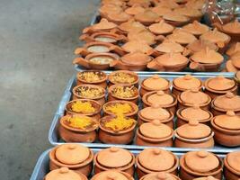 Thai custard cake in small earthenware on tray for sell in market, Thailand. photo