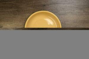 Enamel tin metal food plate pot bowl retro vintage tableware dinnerware on rustic wood background top view photo