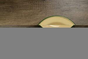 Enamel tin metal food plate pot bowl retro vintage tableware dinnerware on rustic wood background top view photo