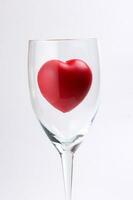 transparent wine glass with three dimension 3d red hart symbol inside on white background copy text space photo