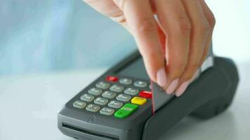 Woman paying with contactless credit card. Wireless money transaction. Wireless payment video