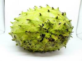 Soursop fruit on white isolated background. soursop in indonesia, Annona muricata. photo