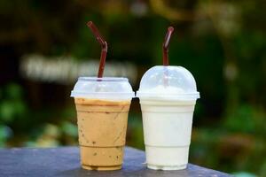 Iced coffee and iced milk in the garden photo