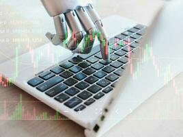 Robotic hand of technology in finance and investment. photo