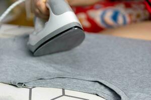 clothes iron make the clothes smooth and beautiful photo