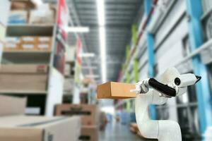 Industrial technology using robots mechanical arm the box in the factory photo