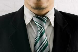 The beard on the face of a man wearing a suit photo