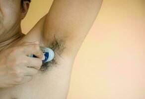 Hand man armpit deodorant with deodorant photo