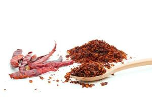 Dried chili meal on a white background photo