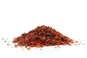 Dried chili meal on a white background photo