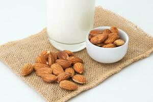 Milk Almonds in a glass on a white background photo