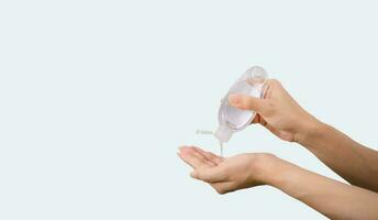 Alcohol hand sanitizer on a woman's hand photo