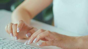 Woman typing credit card number on computer keyboard. She making online purchase. Online payment service video