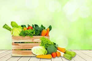 Banner design concept of fresh organic and vegetables on wooden table outdoors. photo