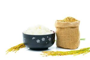 Rice of paddy Golden yellow in a sack on a white background photo